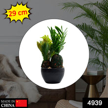 Green artificial plant in a stylish pot