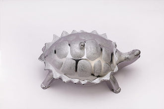 Tortoise-shaped container for dry fruits or presents.